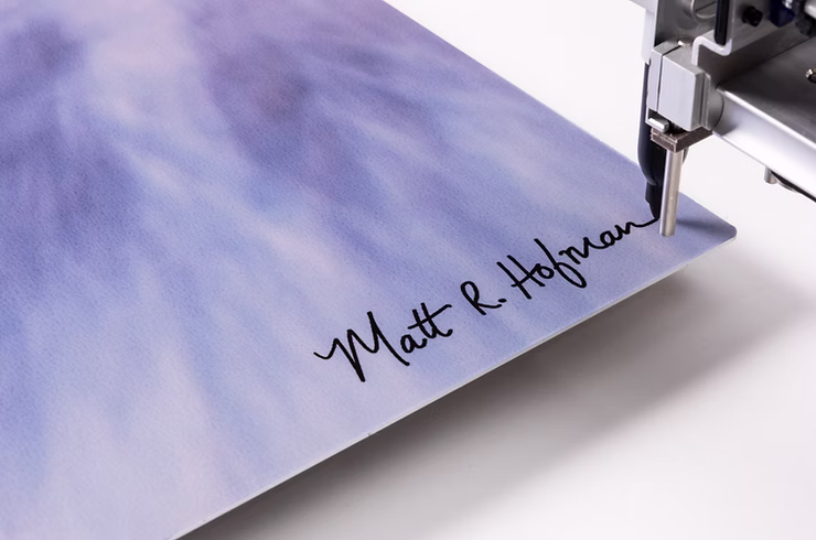 signature-pen-machine-adding-a signature-to-a-print.png
