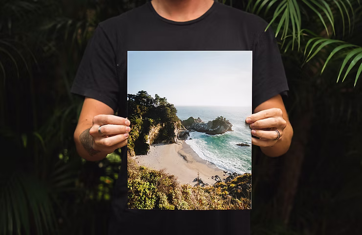 person-holding-photo-of-beach.jpg