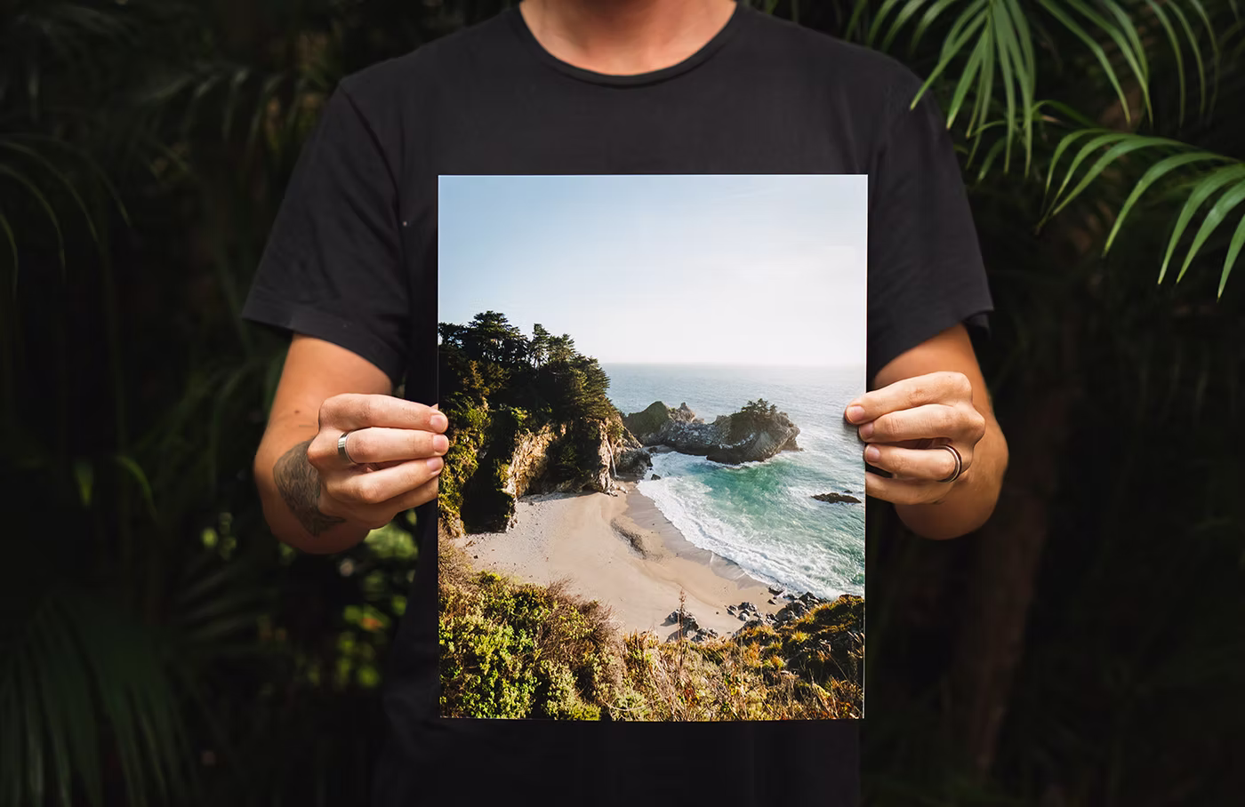 person-holding-a-print-of-beach.jpg
