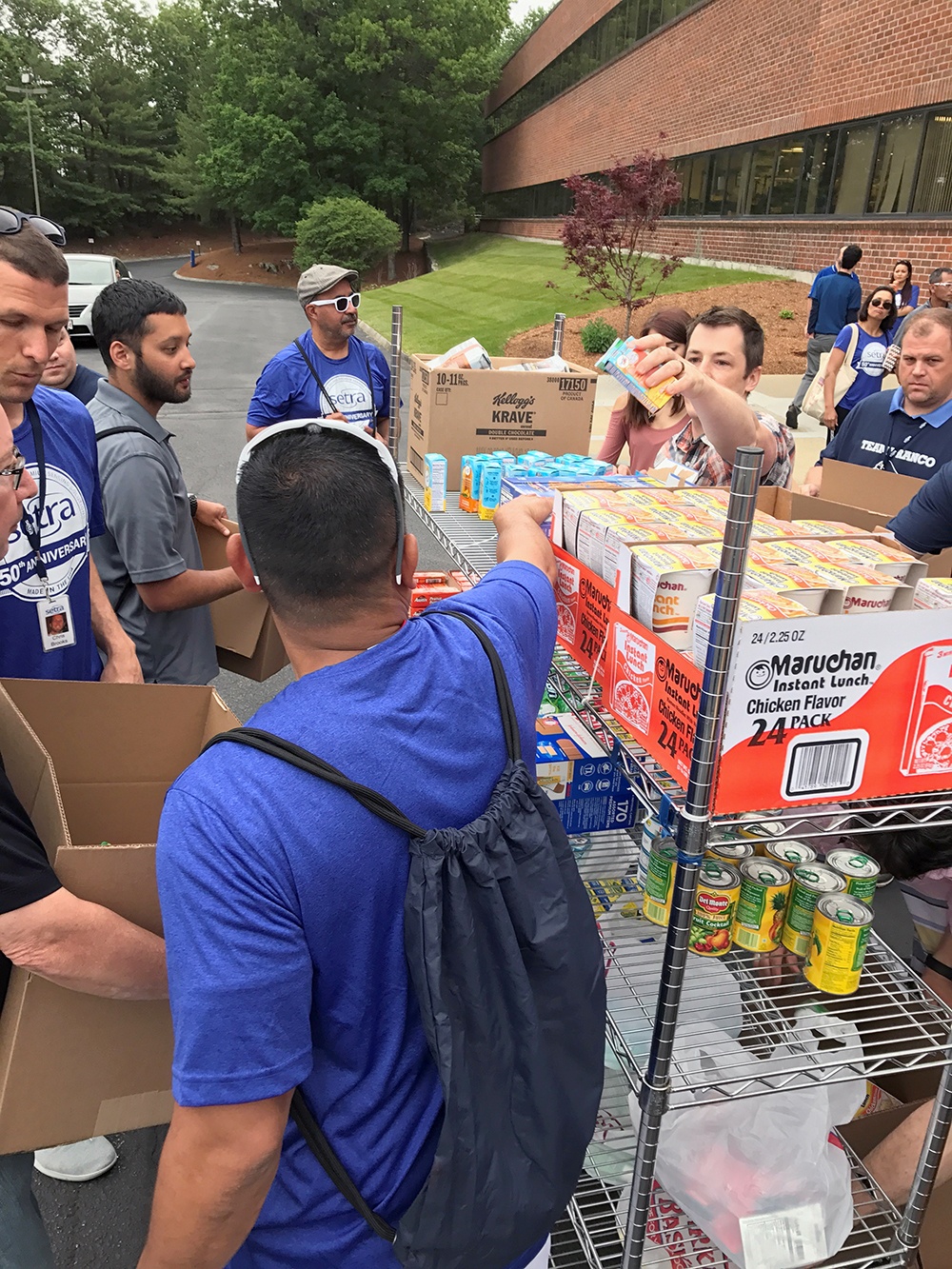 Setra associates prepare care packages for 