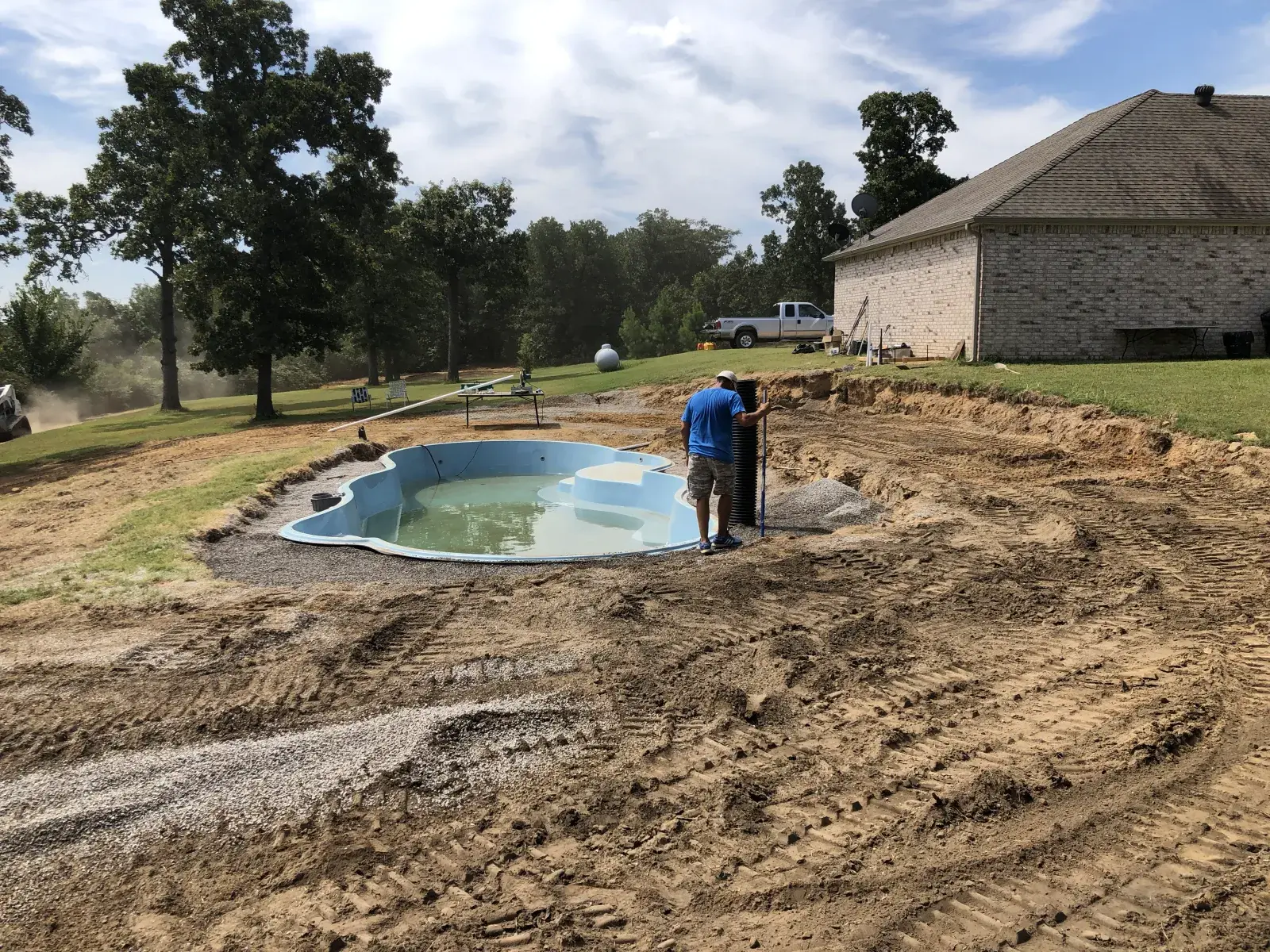 Fiberglass pool being constructed.
