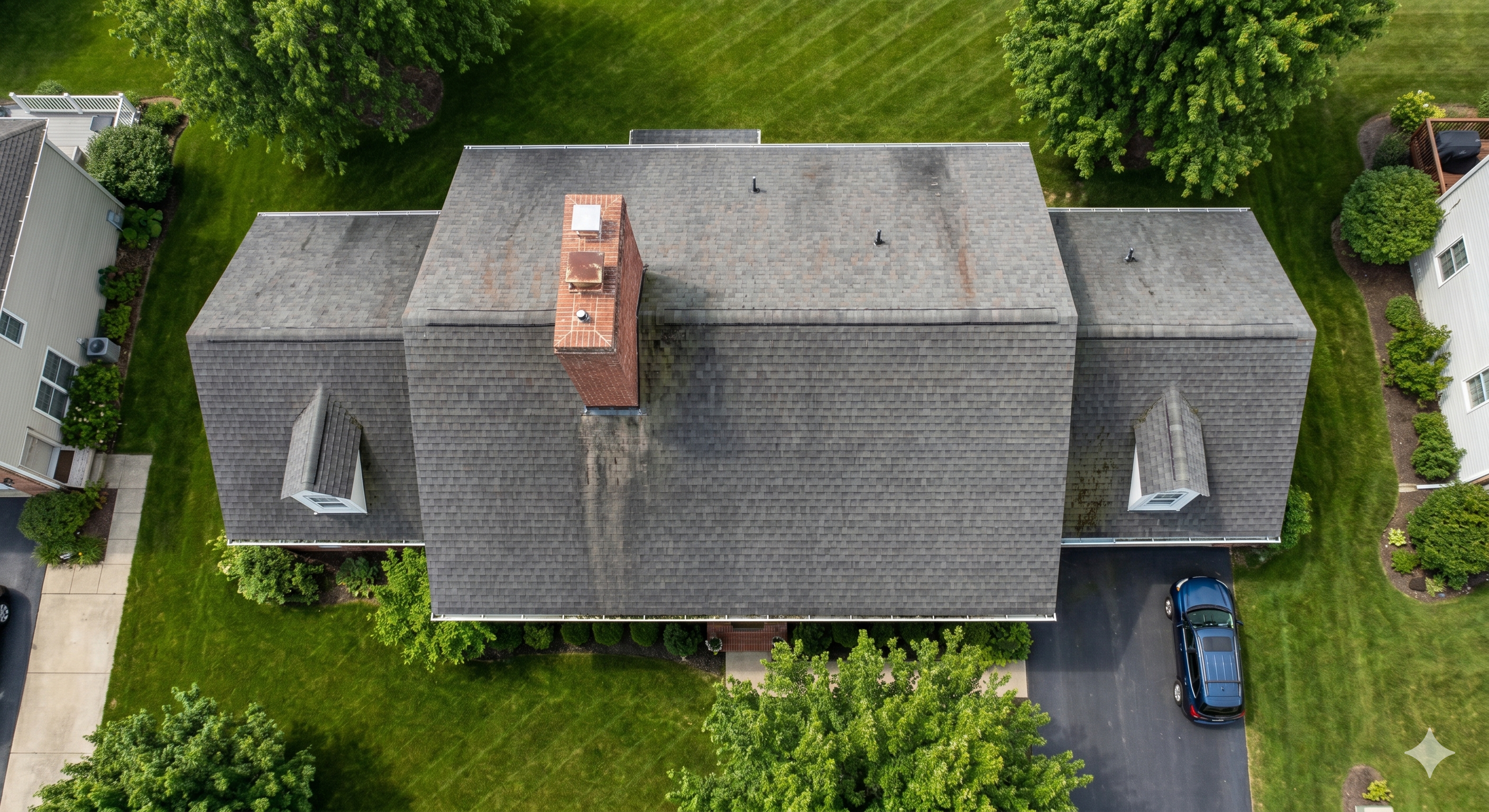 Aerial drone view of a Massachusetts residential roof during a professional inspection flight