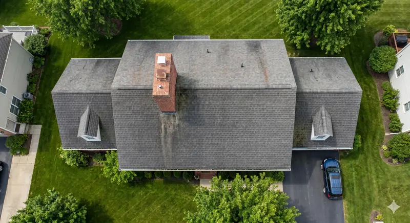 Aerial drone view of a Massachusetts residential roof during a professional inspection flight