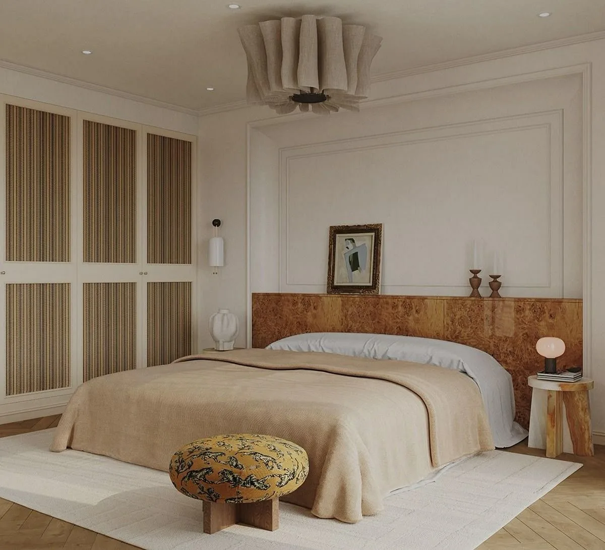 A realistic 3D visualization of a warm, neutral bedroom bathed in natural light, featuring a burl wood headboard, a textured beige bedspread, and a patterned round ottoman.