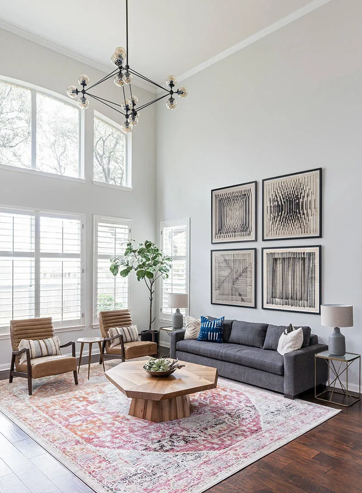 High-Ceiling Modern Living Room - Living Room interior design by Decozie