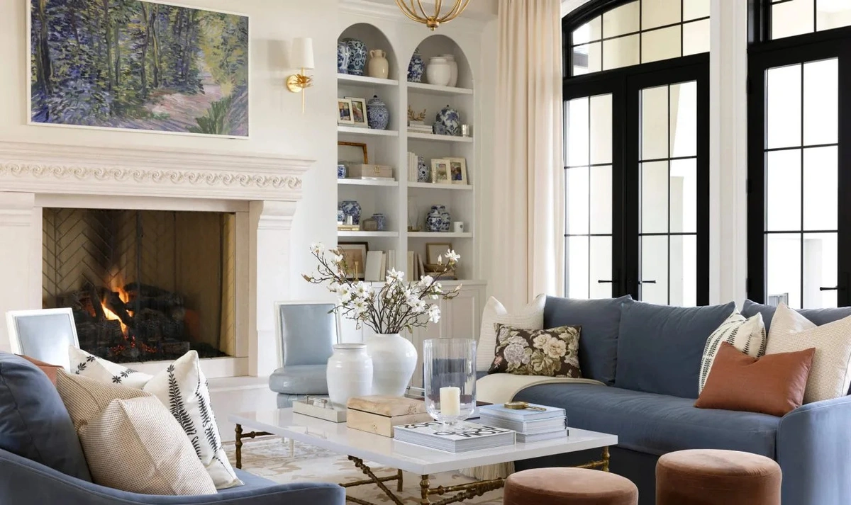Inviting Living Room with Blue Sofas and Warm Rust Velvet Accents - Living Room interior design by Decozie