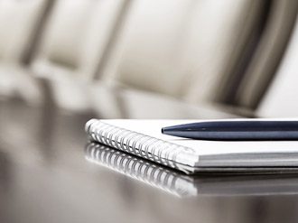 Pen on a notepad on a desk